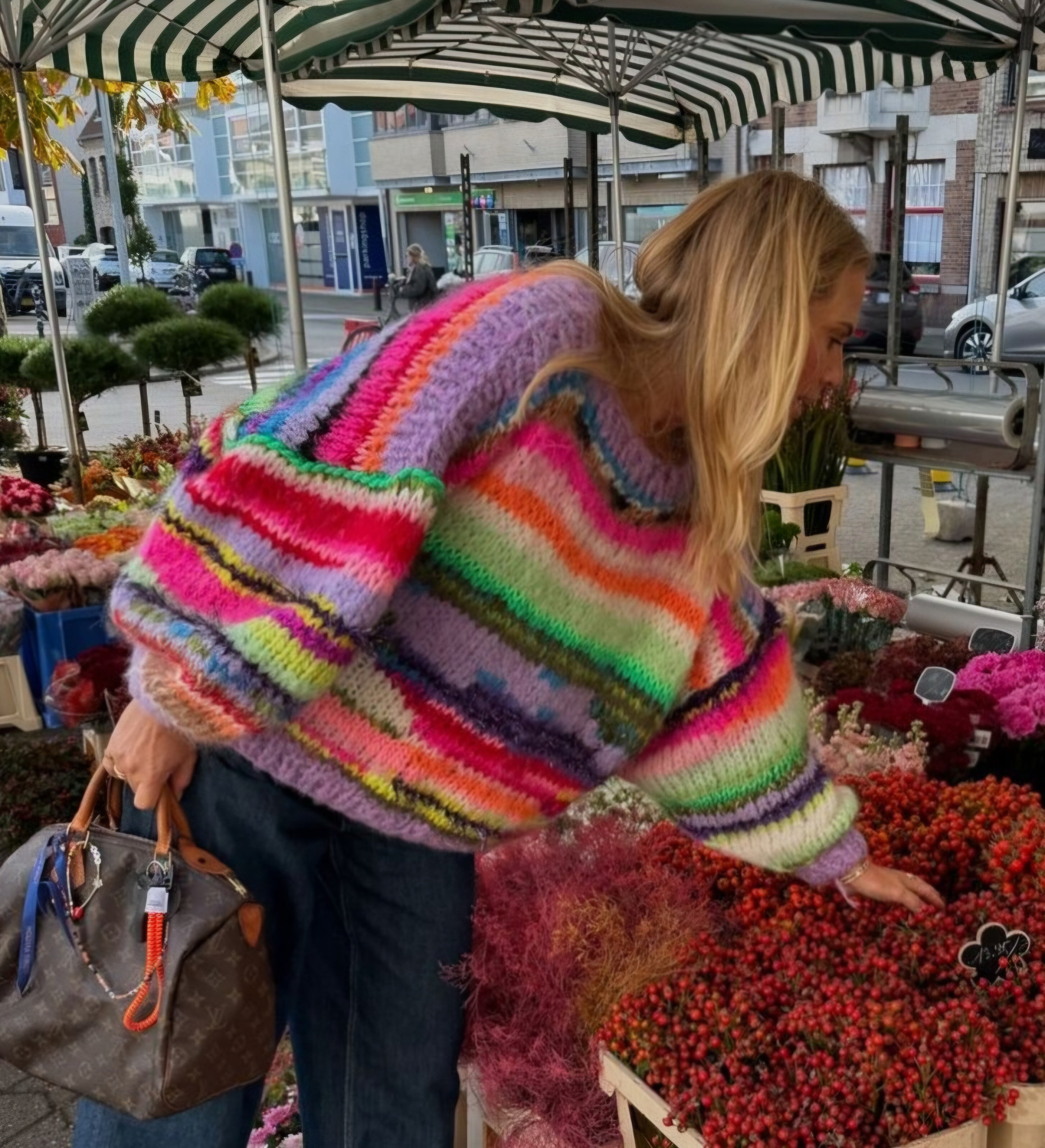 A handknitted colorful sweater worn by Ellemieke Vermolen