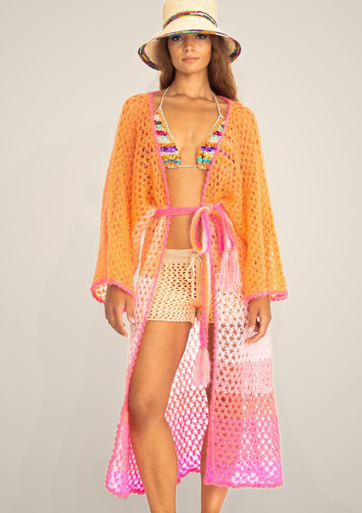  a handcrochet silk kimono in silk and kid mohair in ombre shades from pink to orange.