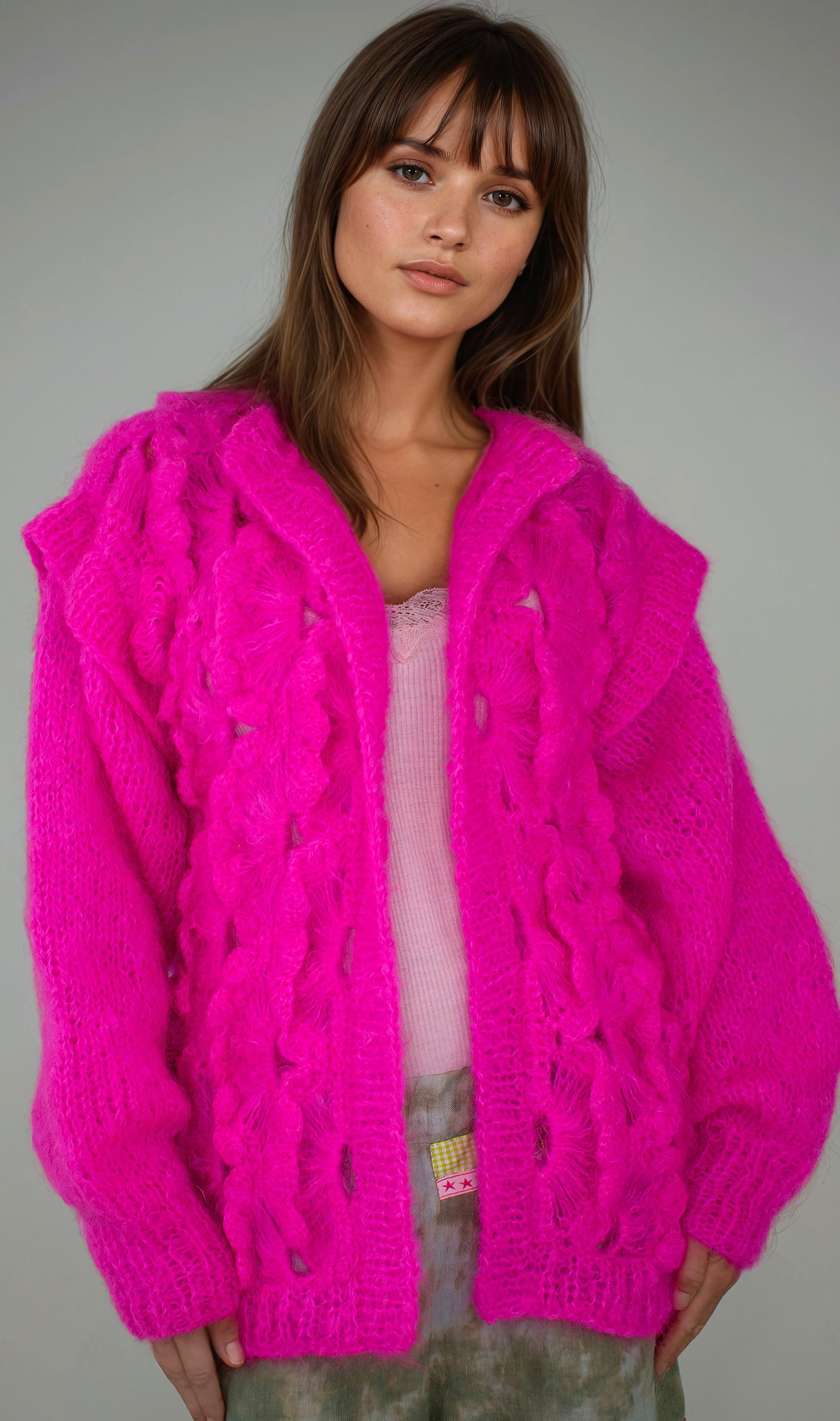 girl in handcrochet neon pink jacket